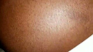 My girlfriend, feeling horny, eagerly sucks my black cock in our amateur homemade session