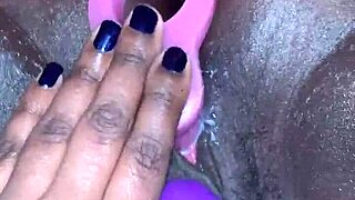 Creamy ebony orgasm, she moans during toy play.