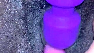 Creamy ebony orgasm, she moans during toy play.