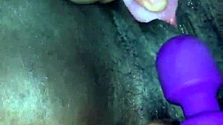 Creamy ebony orgasm, she moans during toy play.