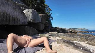 Curvy nudist with hairy pussy on the beach