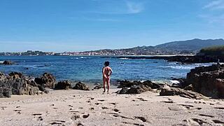 Curvy nudist with hairy pussy on the beach