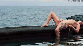 watch this free spirit girl squirt by the shore