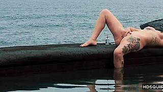 watch this free spirit girl squirt by the shore