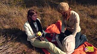 a couple of brunettes enjoy a hike with strapon activities and outdoor fun