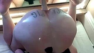 Amateur fuckpig bucks against her dildo on the mirror
