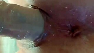 Amateur fuckpig bucks against her dildo on the mirror