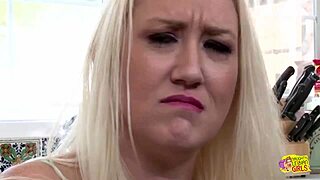 Blonde friends share a casual kitchen kiss and touch