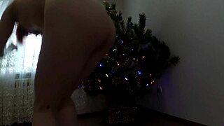 Beautiful Bitch Dancing Seductively Around Christmas Tree with Small Tits Exposed