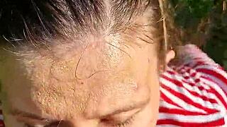 fucking the wet brunette's slobbery mouth with big cock in outdoor forest on hot summer day