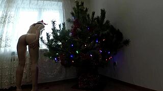 Beautiful Bitch Dancing Seductively Around Christmas Tree with Small Tits Exposed