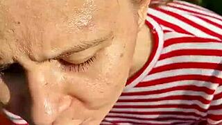 fucking the wet brunette's slobbery mouth with big cock in outdoor forest on hot summer day