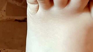 Greta Applying Nail Polish to Toenails