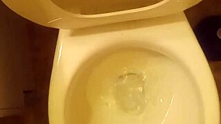 21 year old taking a piss in the toilet with a bit of penis showing