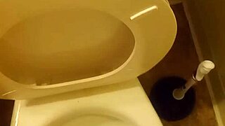 21 year old taking a piss in the toilet with a bit of penis showing
