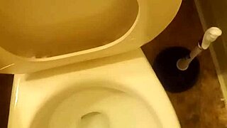 21 year old taking a piss in the toilet with a bit of penis showing