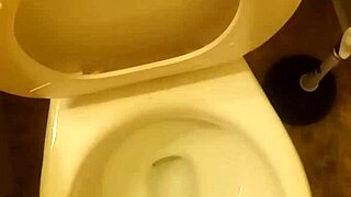 21 year old taking a piss in the toilet with a bit of penis showing