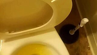 21 year old taking a piss in the toilet with a bit of penis showing