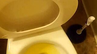 21 year old taking a piss in the toilet with a bit of penis showing