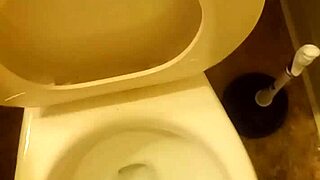 21 year old taking a piss in the toilet with a bit of penis showing