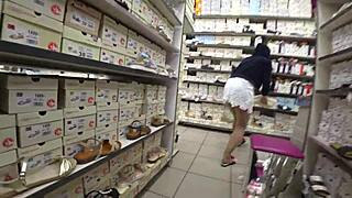 Peeping gorgeous ass under skirt in nylon pantyhose