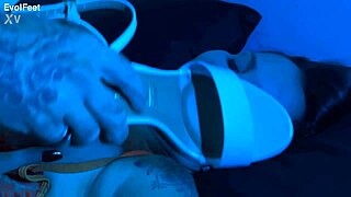 She expertly sucks and licks toes, giving detailed footjobs with big natural tits bouncing