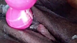 a plump ebony woman enjoys a relaxing massage at home