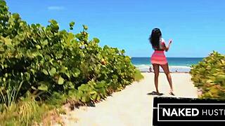 the gorgeous ebony babe with a big round ass deepthroats on the beach before getting fucked