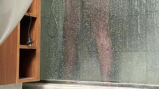 A BBW person is caught engaging in masturbation activities in the shower area quietly