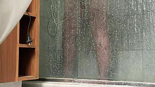 A BBW person is caught engaging in masturbation activities in the shower area quietly