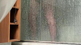 A BBW person is caught engaging in masturbation activities in the shower area quietly