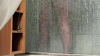 A BBW person is caught engaging in masturbation activities in the shower area quietly