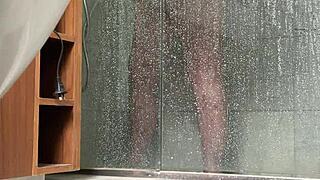 A BBW person is caught engaging in masturbation activities in the shower area quietly