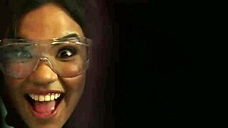 Two college students prepare for bed in their dorm room