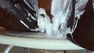 black milf meticulously shaves her wet ebony pussy on camera