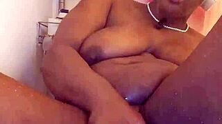 black milf meticulously shaves her wet ebony pussy on camera