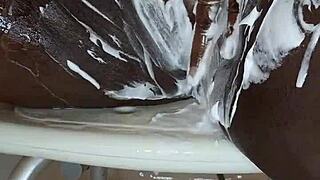 black milf meticulously shaves her wet ebony pussy on camera