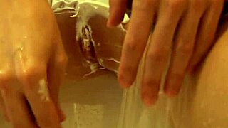 Puffy Redhead Shaves Smooth Pussy Close-Up in Steamy Shower