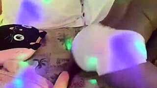 Gagged and handcuffed black model rides glass dildo wildly while fingering pussy