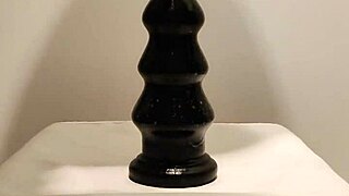 latexi69 teases with buttplug in latex play