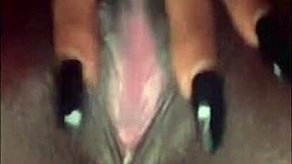 Gagged and handcuffed black model rides glass dildo wildly while fingering pussy