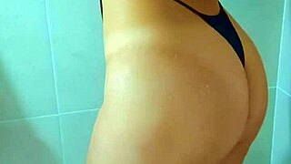 brazilian stunner seduces in dripping wet black thong shower tease