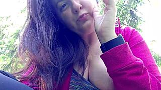 Nicoletta puffs cig in garden flashing huge tits from her shirt