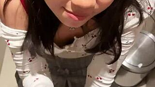 18-year-old asian cutie drops to knees for huge facial cumshot in public restroom blowjob