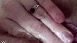 her fingers dive deep into the creamy folds of her pulsing cunt