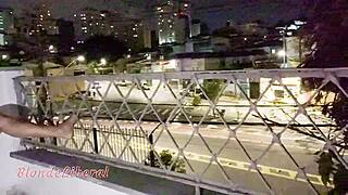 Street watches whore fuck on public balcony