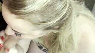 pretty tattooed blonde with big tits deepthroats huge cock in sexy lingerie on bedroom bed