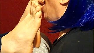 She kneels down eagerly wrapping lips around each of my toes sucking passionately with foot fetish desire