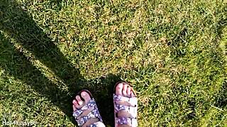 She slips off her flip-flops for a barefoot outdoor tease in the fields