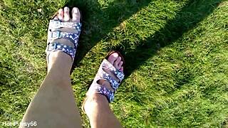 She slips off her flip-flops for a barefoot outdoor tease in the fields